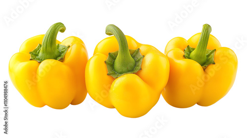 Three ripe yellow bell peppers on a white isolated background.