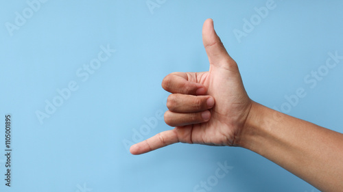 Hand gesture call me isolated on blue