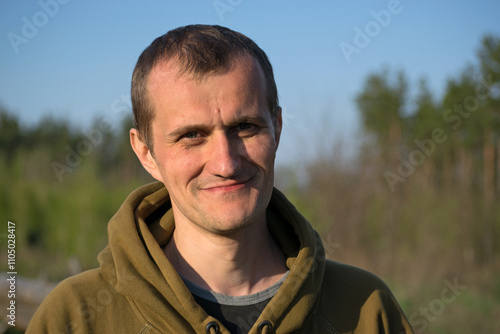 man portrait. the guy against the backdrop of nature. photo, smiling, thoughtful, surprised, indignant, feelings, emotions. fair skin, slight stubble. man 30-40 years old. close-up. European