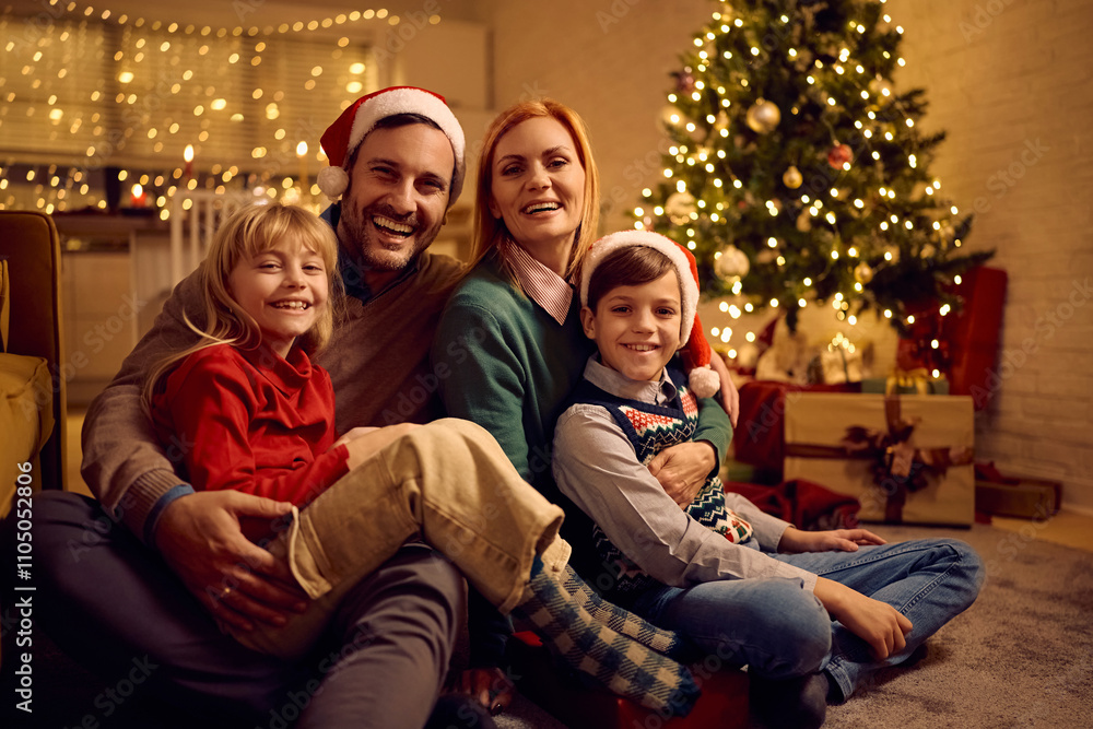 Portrait of happy family on Christmas Eve at home looking at camera. Portrait of happy family on Christmas Eve at home looking at camera.