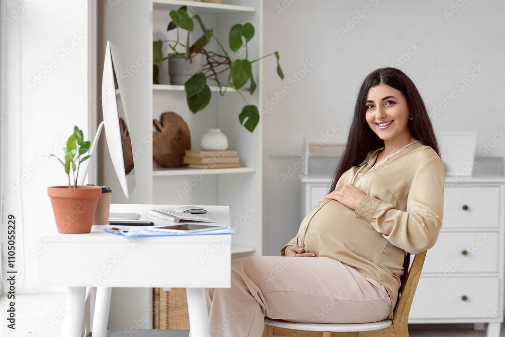Pregnant businesswoman working at home office Pregnant businesswoman working at home office