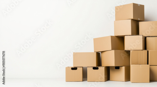 Stacked cardboard boxes against a wall