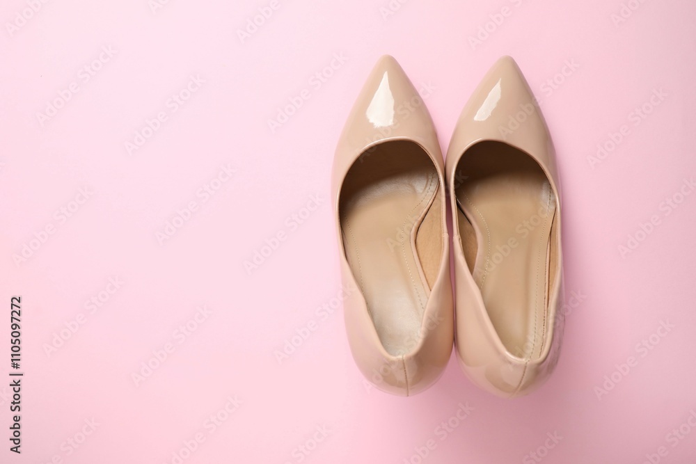 Stylish classic women's beige high heel shoes on color background. Top view, flat lay Stylish classic women's beige high heel shoes on color background. Top view, flat lay