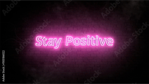 Pink Neon Sign Saying 'Stay Positive' on Dark Brick Wall Background