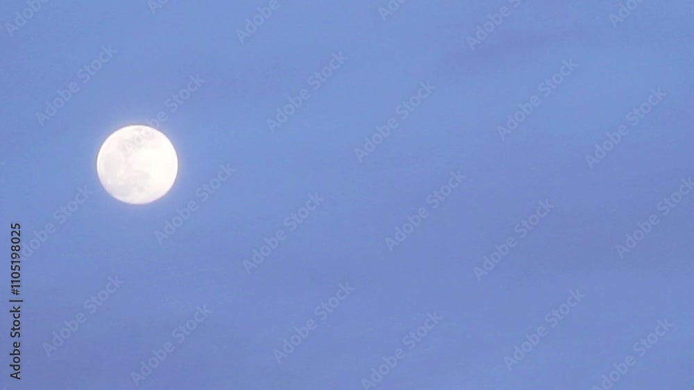 Moonrise over a clear sky during twilight brings a calm and tranquil atmosphere to the evening scenery in nature Moonrise over a clear sky during twilight brings a calm and tranquil atmosphere to the evening scenery in nature