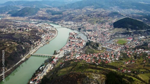 Wallpaper Mural Stunning aerial view of a picturesque town by the river in a mountainous region during the day Torontodigital.ca