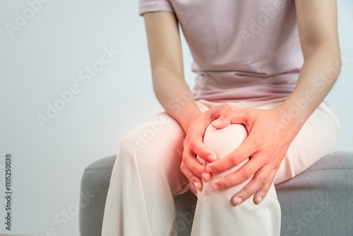 Asia female athlete or spot woman having knee injury due to ligament inflammation, knee pain due to exercise, massage, muscle relaxation, rheumatoid arthritis, gait disturbance, rheumatoid arthritis photo