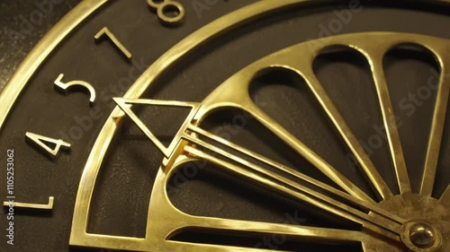 Close up view on Antique bronze dial indicator, for the movement of the elevator cabin in the form of a dial in a luxury hotel