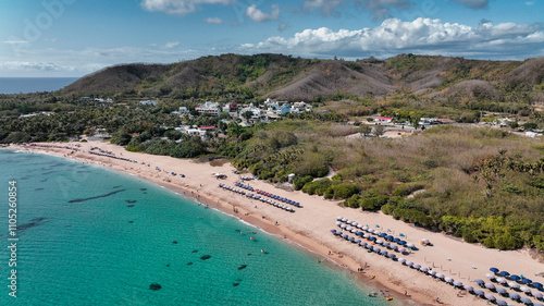 Aerial view of Kenting Baishawan beach in Taiwan featuring sun loungers and clear blue waters photo