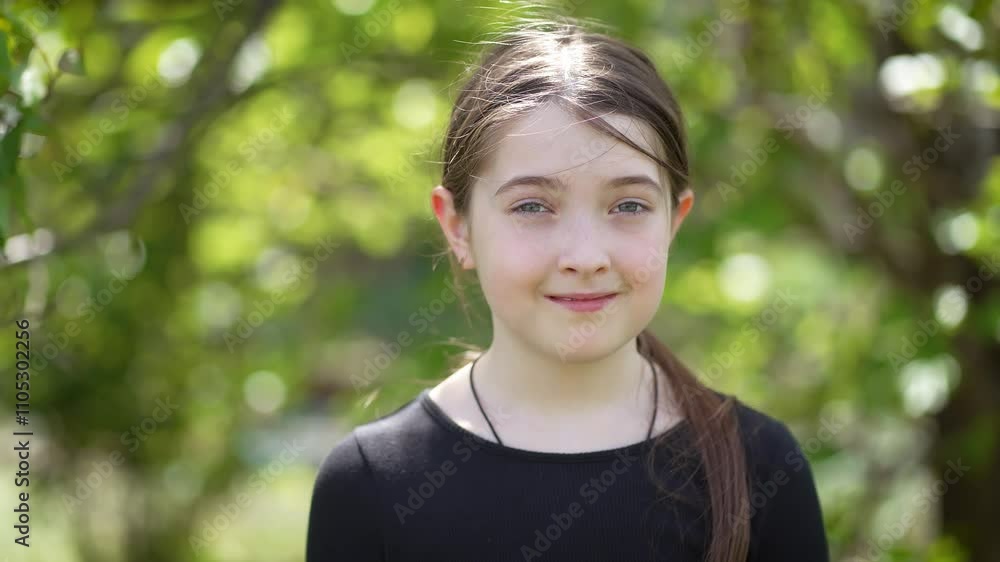 Teenage Girl Playfully Raises Her Eyebrows While Enjoying Sunny Day Outdoors in Natural Setting With Greenery Surrounding. Little cute teenage female outdoor, kid expression. Children on nature Teenage Girl Playfully Raises Her Eyebrows While Enjoying Sunny Day Outdoors in Natural Setting With Greenery Surrounding. Little cute teenage female outdoor, kid expression. Children on nature