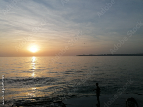 Sunset on beach showing sky and island