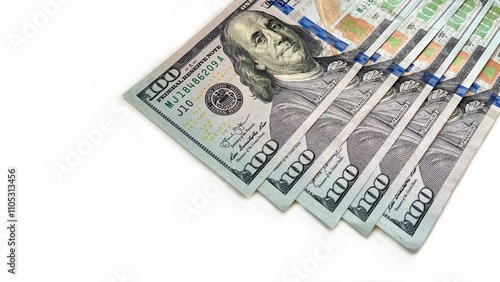 A fanned arrangement of 100 U.S. bills on a clean white background, symbolizing wealth, finance, and prosperity. Suitable for content related to banking, financial services, or economic growth. photo