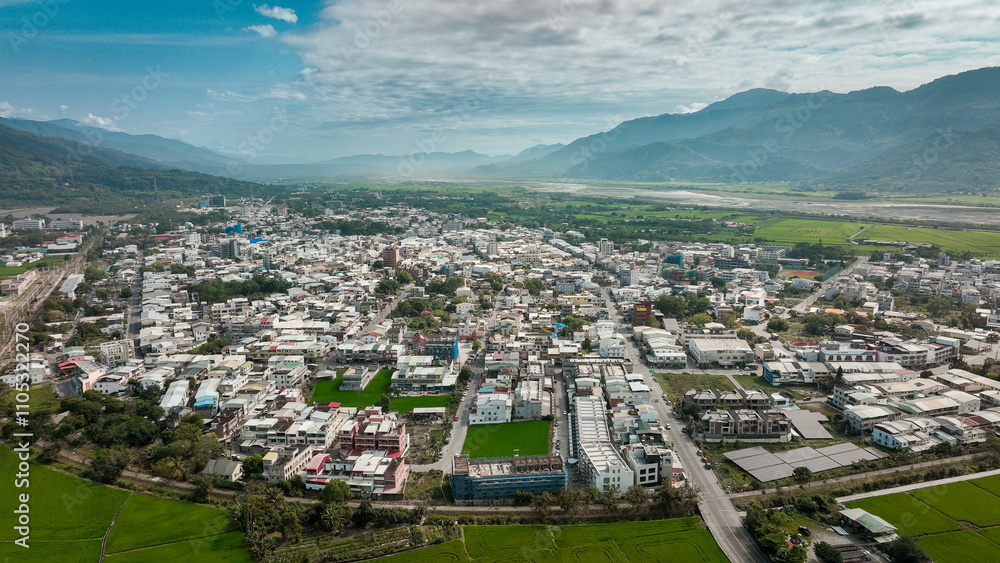 Fototapeta premium Aerial view of Yuli, featuring lush valleys and peaceful urban landscapes in Taiwan