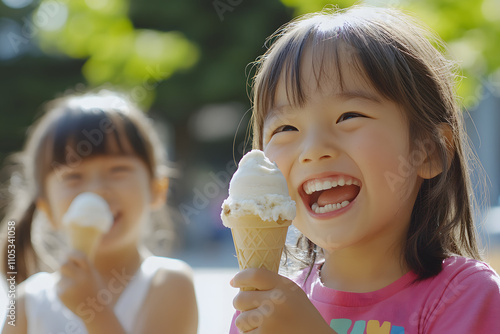 Joyful Children Enjoying Ice Cream on Sunny Park Day   photo