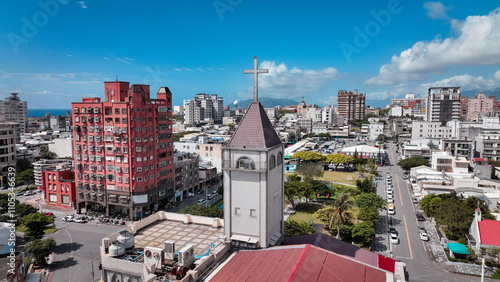 Cityscape featuring a church and urban buildings in Hualien Taiwan on a clear day photo