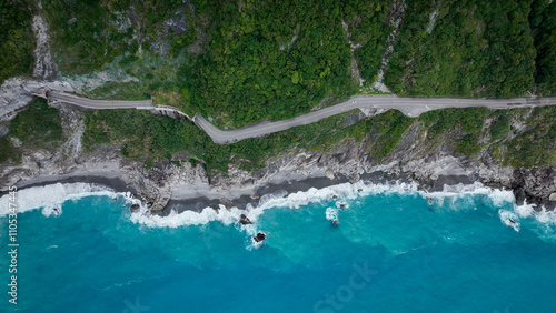 Aerial view of Hualiens coastline and winding road along the vibrant blue ocean