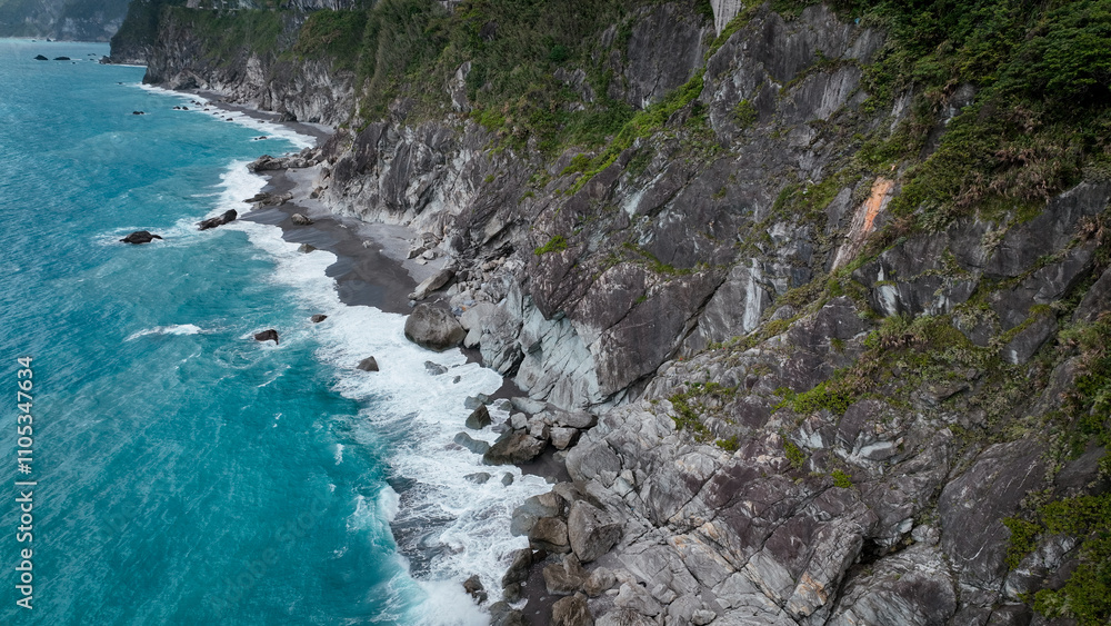 Stunning coastal view of rugged cliffs and turquoise waters in Hualien, Taiwan Stunning coastal view of rugged cliffs and turquoise waters in Hualien, Taiwan