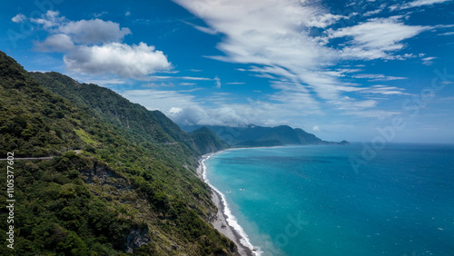 Stunning coastal view of Taiwan shoreline with lush mountains and a deep blue ocean