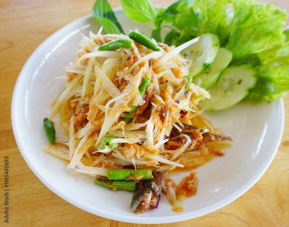 Spicy mackerel with papaya Salad, Thai spicy food Spicy mackerel with papaya Salad, Thai spicy food