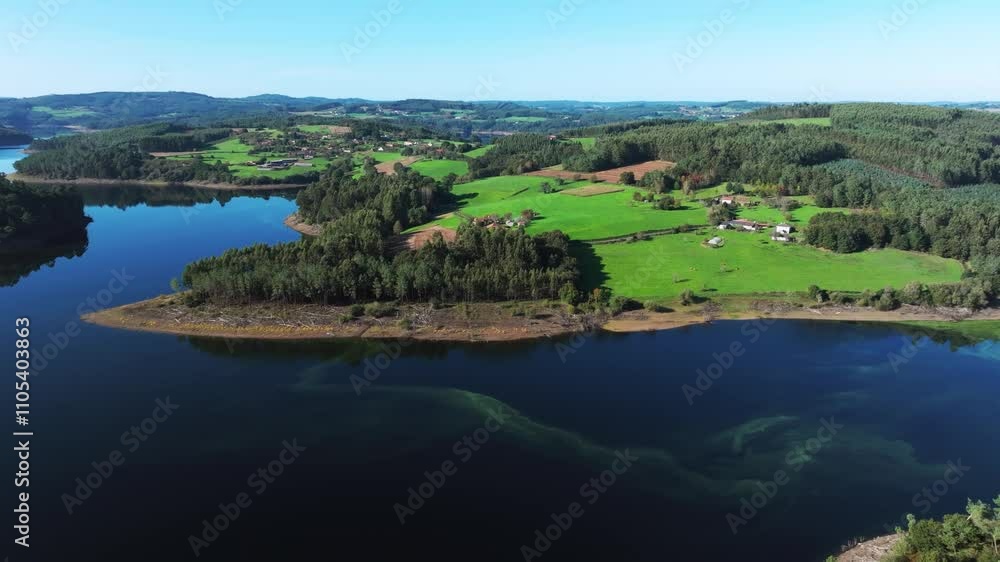 Aerial View Of Portodemouros Lake With Green Forest And Hills In La Coruña, Spain. Aerial View Of Portodemouros Lake With Green Forest And Hills In La Coruña, Spain.