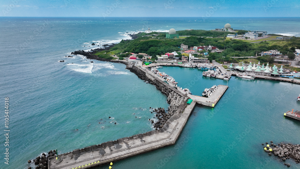 Aerial view of a scenic harbor and coastal landscape in Taiwan during a clear day Aerial view of a scenic harbor and coastal landscape in Taiwan during a clear day