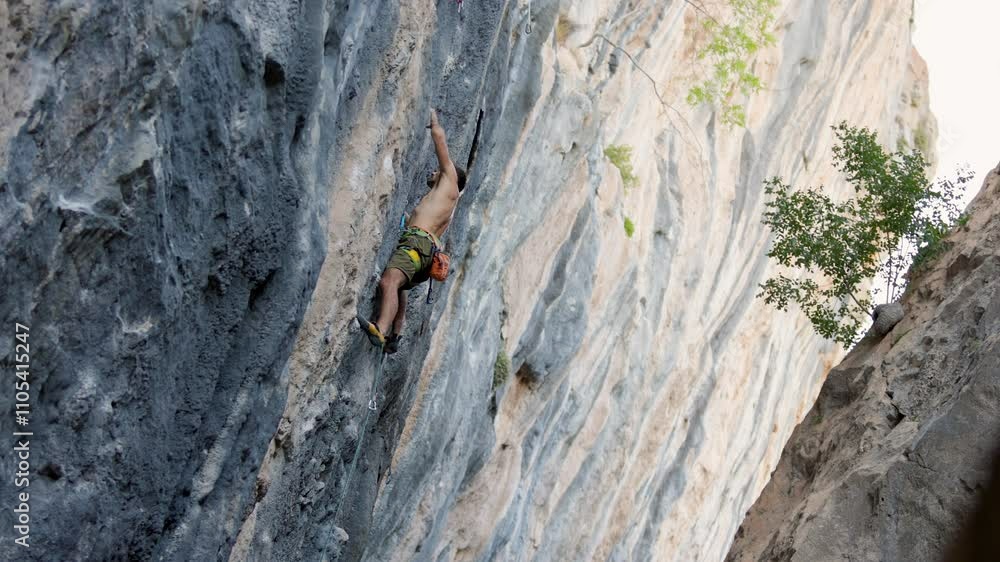 rock climber climbs a rock. a strong man overcomes a difficult route. relaxation and freedom in nature. A strong man. rock climber training. rock climber climbs a rock. a strong man overcomes a difficult route. relaxation and freedom in nature. A strong man. rock climber training.