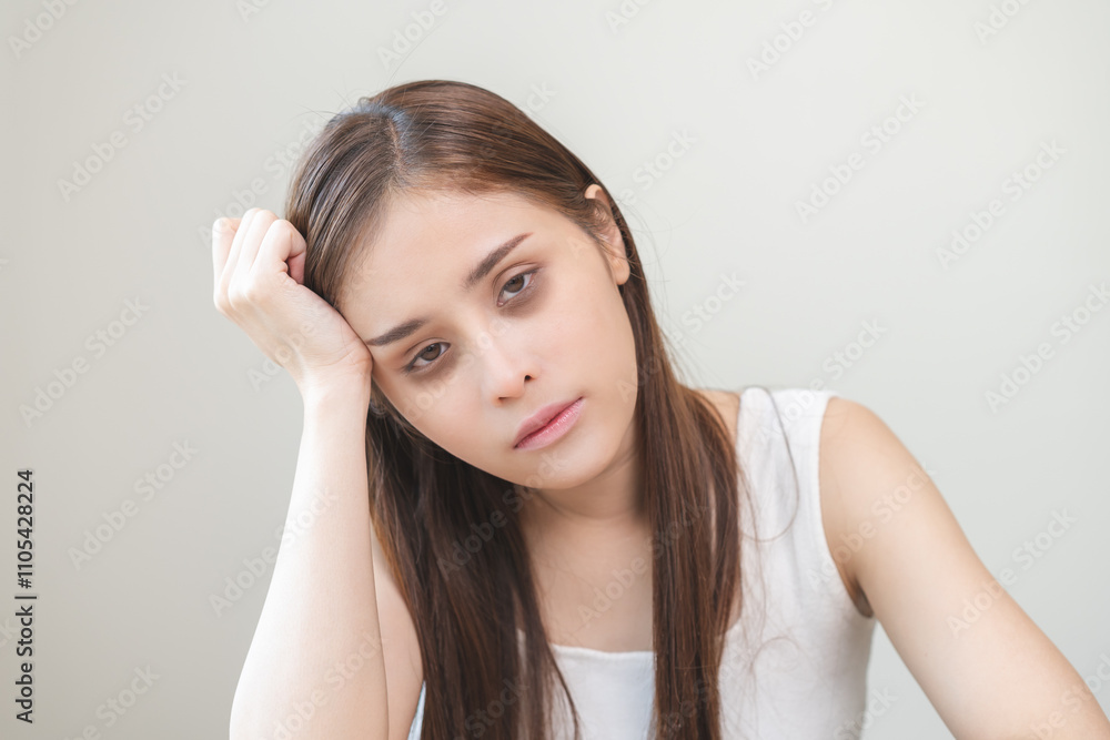 Bored, insomnia asian young woman, girl looking at camera, hand touching under eyes with problem of black circles or panda puffy, swollen and wrinkle on face. Sleepless, sleepy healthcare person. Bored, insomnia asian young woman, girl looking at camera, hand touching under eyes with problem of black circles or panda puffy, swollen and wrinkle on face. Sleepless, sleepy healthcare person.