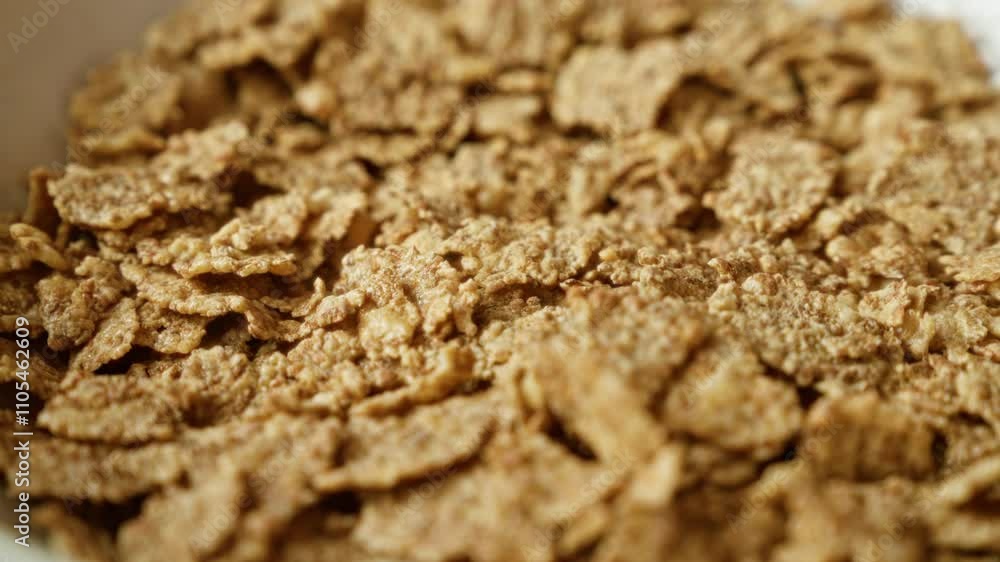 Close-up of crunchy corn flakes in a bowl, showcasing a healthy breakfast cereal suitable for a nutritious morning meal Close-up of crunchy corn flakes in a bowl, showcasing a healthy breakfast cereal suitable for a nutritious morning meal