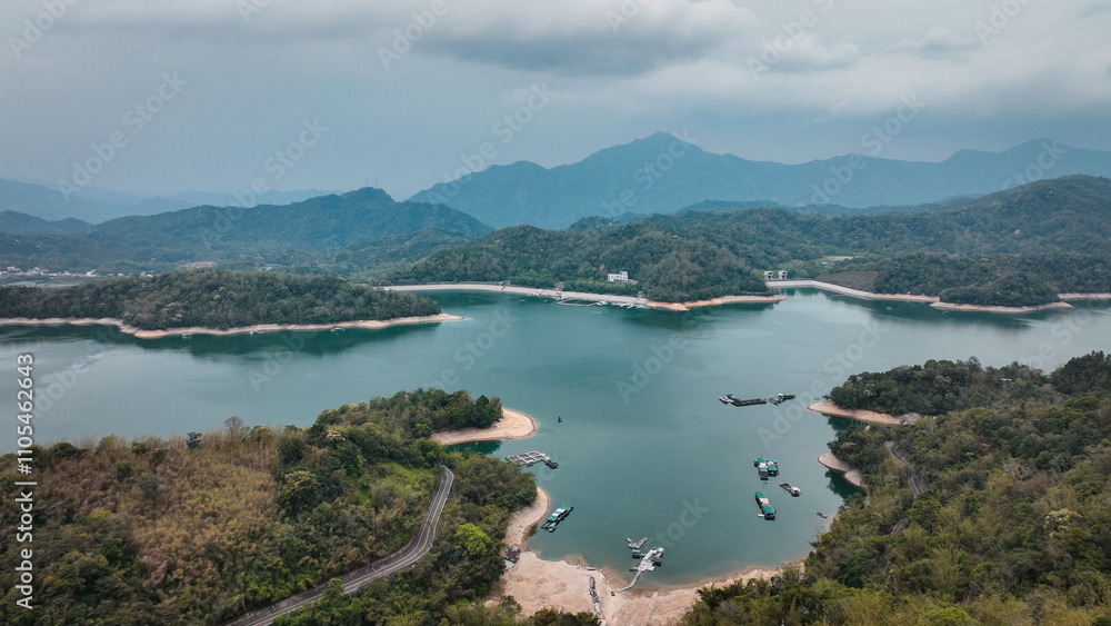 Exploring the serene beauty of Sun Moon Lake in Taiwan surrounded by lush mountains Exploring the serene beauty of Sun Moon Lake in Taiwan surrounded by lush mountains