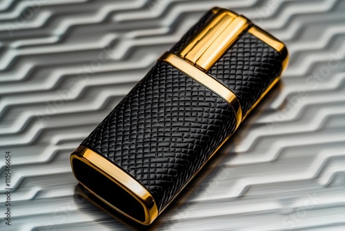 Lighters portable and smoking, A sleek, black and gold USB flash drive rests on a textured metallic surface, showcasing a blend of elegance and modern technology. photo