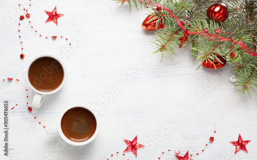 Obraz na płótnie Two cups of coffee and red Christmas decorations on old wooden shabby white table. w salonie