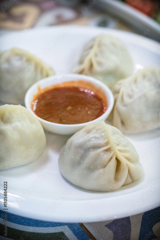 Traditional Kyrgyz manti dumplings served in a traditional restaurant in Bishkek, Kyrgyzstan Traditional Kyrgyz manti dumplings served in a traditional restaurant in Bishkek, Kyrgyzstan