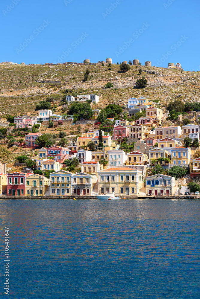 Pastel coloured houses on Symi island. Dodecanese, Greece