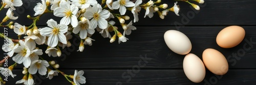 Decorative spring arrangement featuring eggs and blossoms on a dark wooden surface