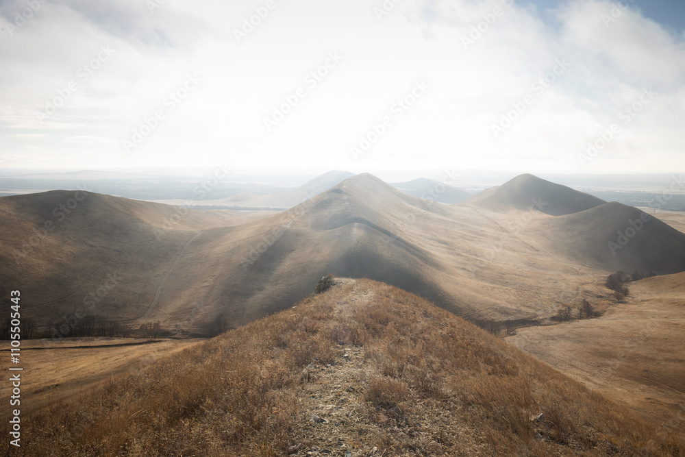Obraz premium monochrome natural landscape with hills at sunrise or sunset in off-season. mountain background