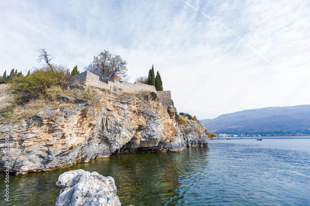 Tranquil Waters and Rugged Rocky Shoreline of Lake Ohrid, North Macedonia