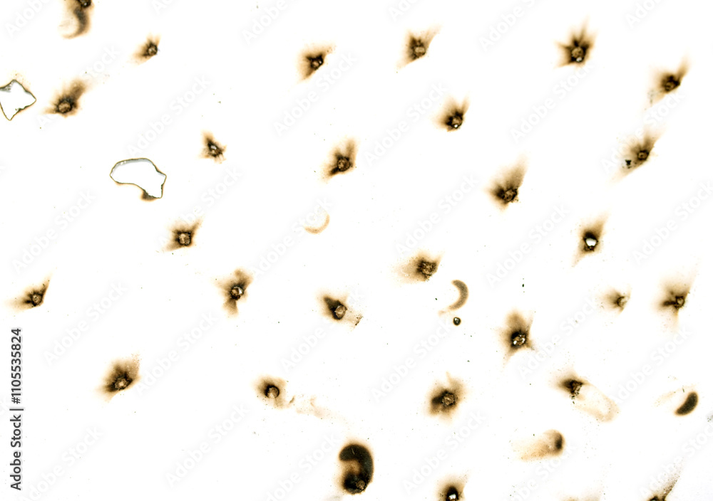 The image is a close up of a white background with a lot of small black dots The image is a close up of a white background with a lot of small black dots