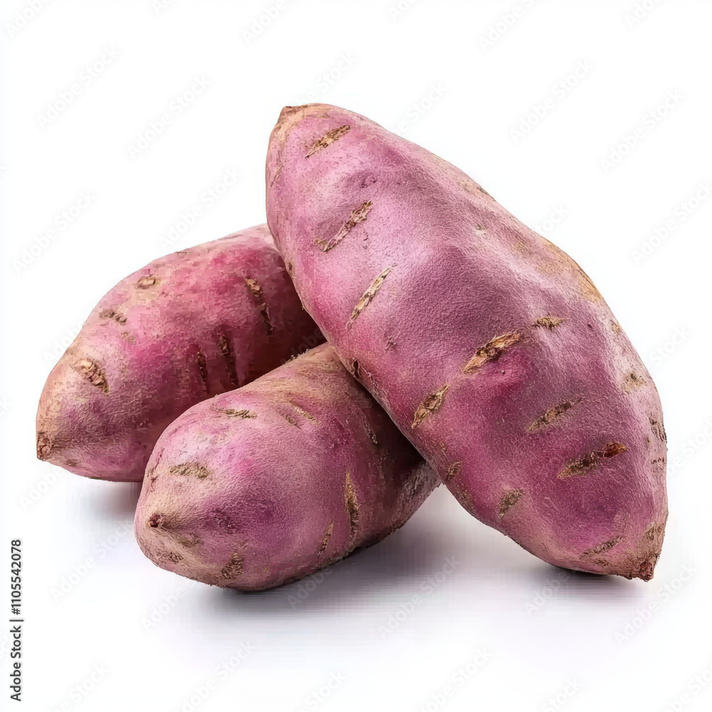 Three fresh sweet potatoes with purple skin are displayed on white background Three fresh sweet potatoes with purple skin are displayed on white background
