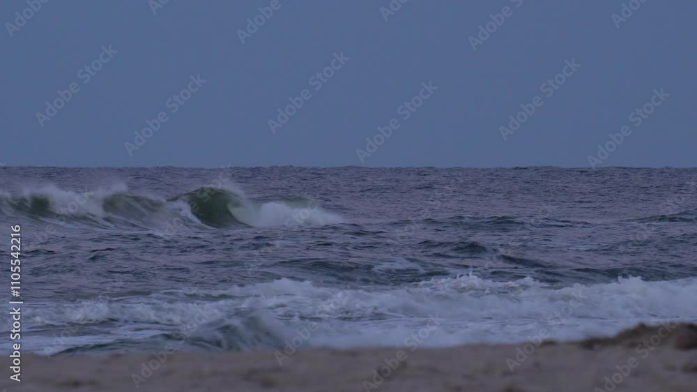 A single wave crest forming on the Baltic Sea during twilight, with soft blue tones and a tranquil atmosphere. A single wave crest forming on the Baltic Sea during twilight, with soft blue tones and a tranquil atmosphere.