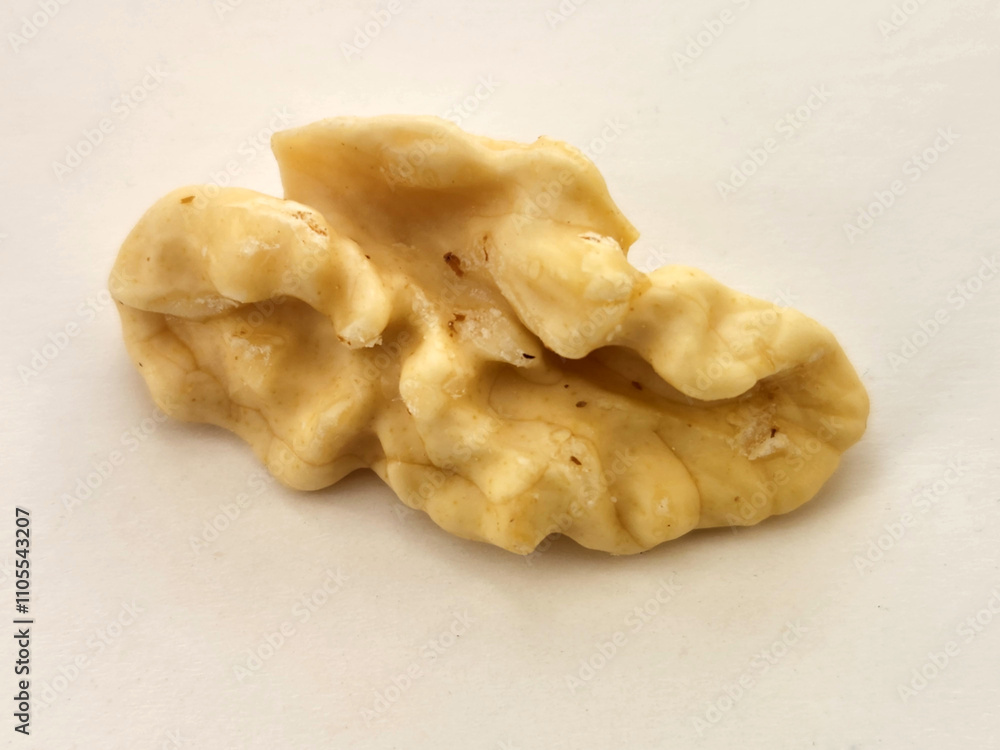 Walnut kernels. Peeled walnut kernel. Walnut kernel on a white background Walnut kernels. Peeled walnut kernel. Walnut kernel on a white background