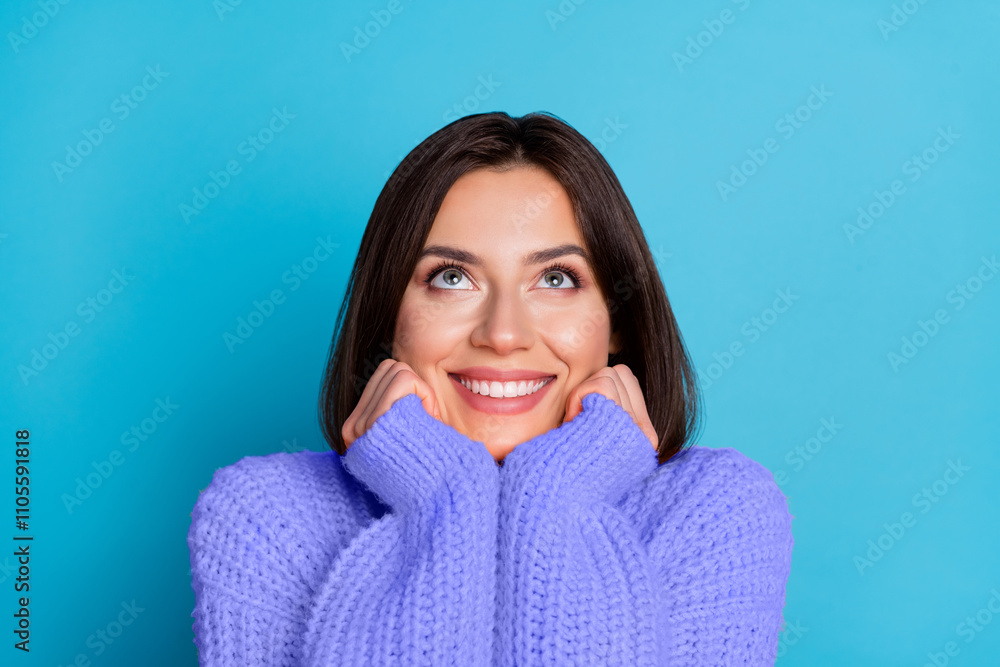 Portrait of attractive cheerful curious girl looking up copy space isolated over shine blue color background Portrait of attractive cheerful curious girl looking up copy space isolated over shine blue color background