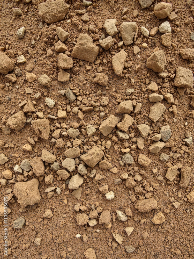 Close-up shot of rough, gritty dirt texture with small rocks, pebbles, and clumps, rocks Close-up shot of rough, gritty dirt texture with small rocks, pebbles, and clumps, rocks