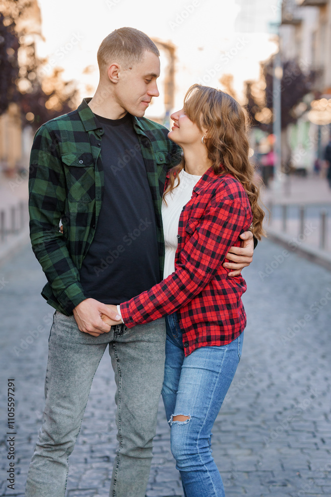 Romantic Autumn Stroll of a Young Couple in Matching Flannel Shirts Romantic Autumn Stroll of a Young Couple in Matching Flannel Shirts