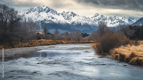 A River Winding Through a Snow-Capped Mountain Range