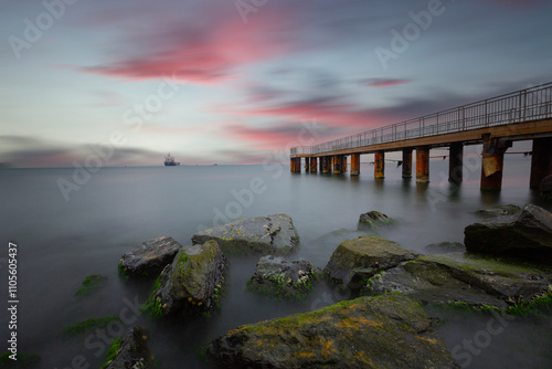 A long exposure photo of a pier