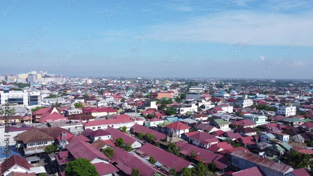 Aerial view of the dense city of Banjarmasin which is full of housing, high rise buildings
