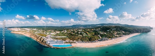 Panoramic view of the white sands of Praia Grande, the largest beach on the Sintra coast, with the Arribas Hotel's seawater pool, the largest in Europe, Sintra Coast, Portugal