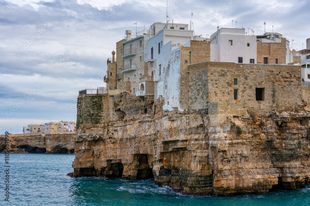 Polignano a Mare historic coastal city with traditional houses on the Adriatic Sea cliffs with turquoise water, Polignano a Mare, Apulia, Italy Polignano a Mare historic coastal city with traditional houses on the Adriatic Sea cliffs with turquoise water, Polignano a Mare, Apulia, Italy