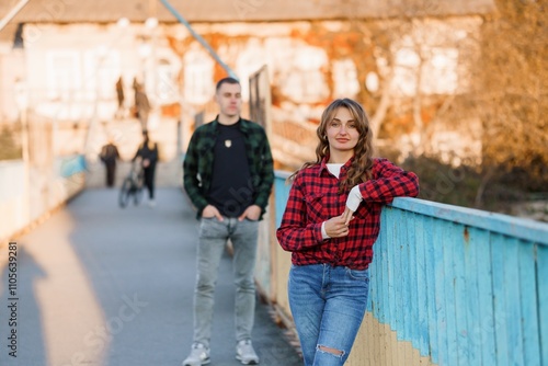 A Charming Couple Enjoying a Scenic Afternoon on a Colorful Bridge