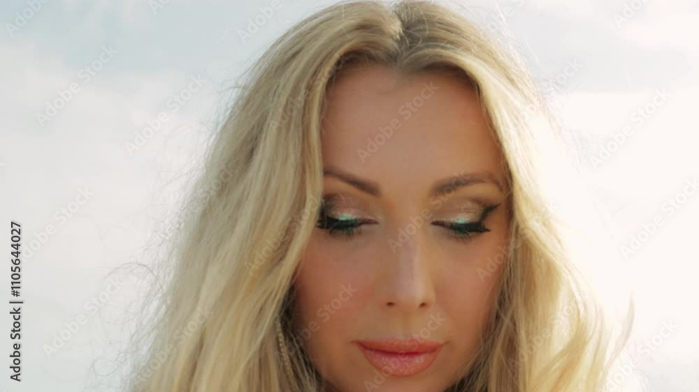 Stunning Woman With Long Blond Hair and Vibrant Green Eyes Poses Elegantly. Girl Radiant Smile and Fresh Complexion Exude Confidence and Charm Against Lively Outdoor Setting Stunning Woman With Long Blond Hair and Vibrant Green Eyes Poses Elegantly. Girl Radiant Smile and Fresh Complexion Exude Confidence and Charm Against Lively Outdoor Setting